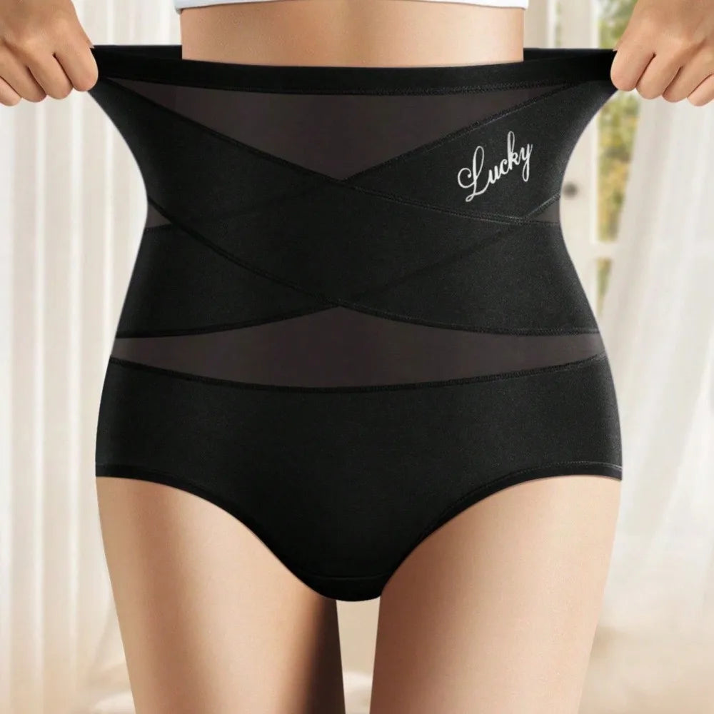 Culotte gainante taille haute noire, bande croisée en X sur le ventre, portée